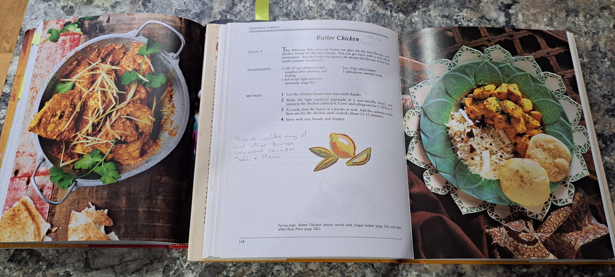 Two recipe books with different butter chicken recipes.